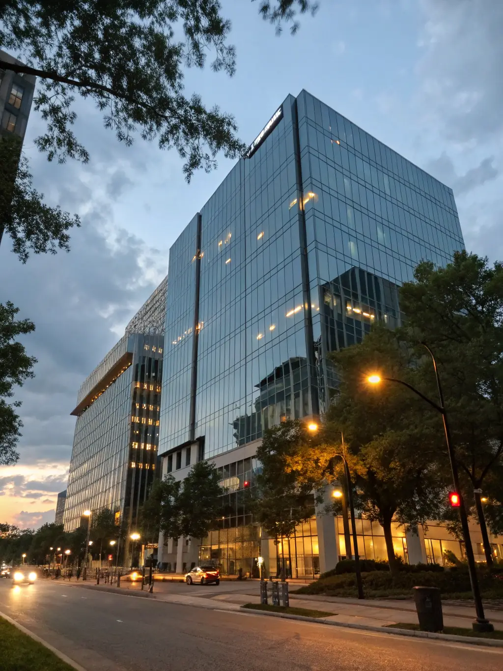 A sleek commercial office building with glass facades, exemplifying modern construction standards.